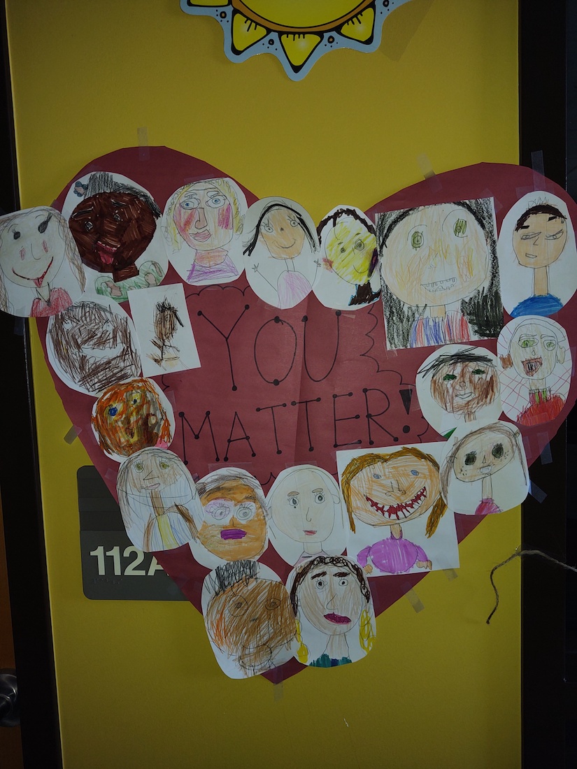 Student drawings in a heart shape