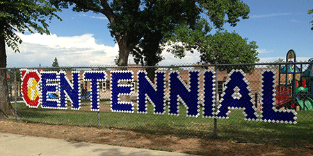 Centennial cups on fence