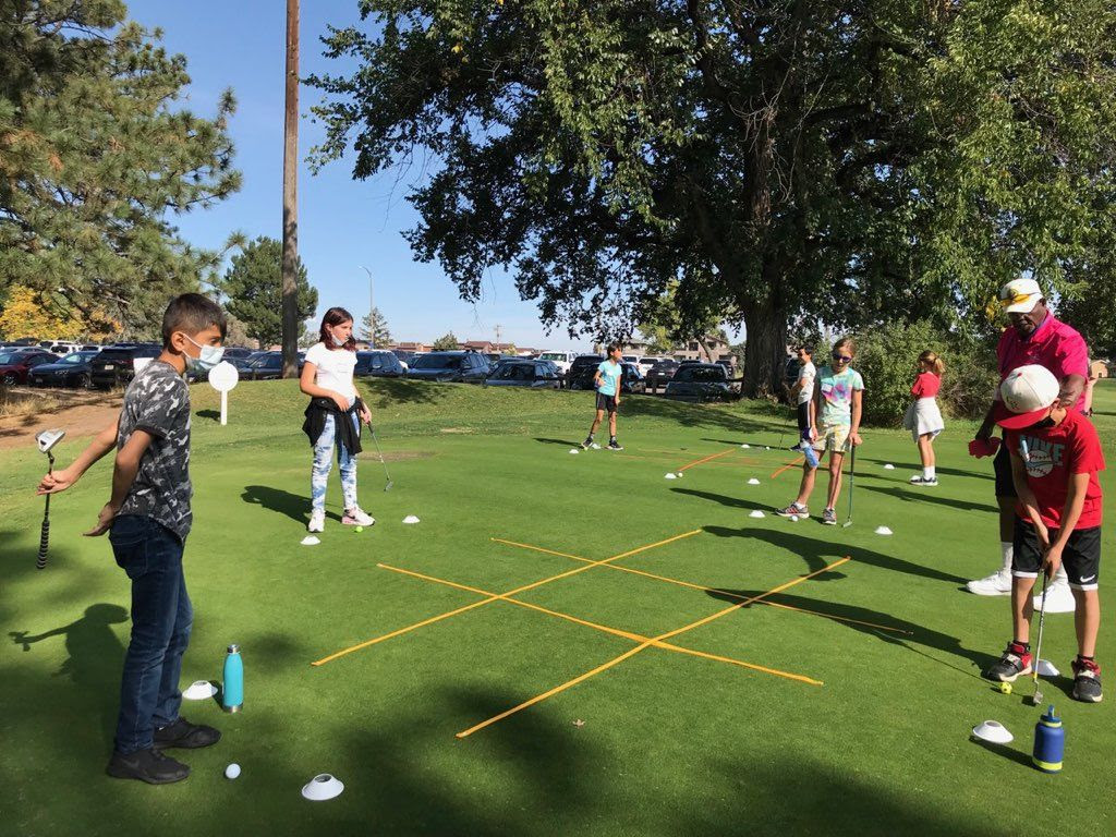 Students playing a golf game outside